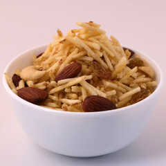 Indian style deep fried snacks falahari chivda- chivda or mixture namkeen with dry fruits.