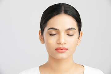 Obraz premium Beautiful indian girl perfect face with closed eyes on white