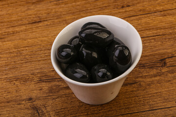 Pickled black olives in the bowl