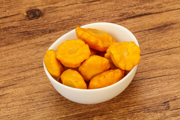 Marinated yellow patisson in the bowl