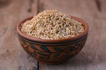 Raw brown rice in a bowl