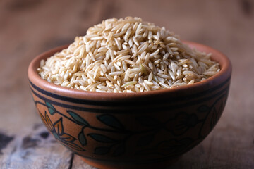 Raw brown rice in a bowl