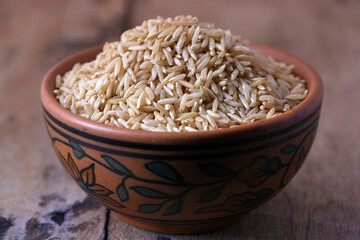 Raw brown rice in a bowl