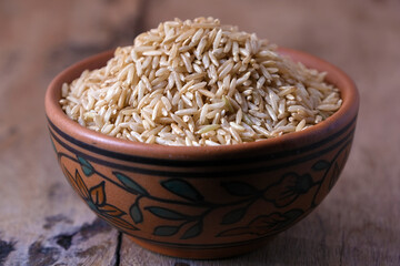 Raw brown rice in a bowl
