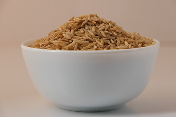 Raw brown rice in a bowl
