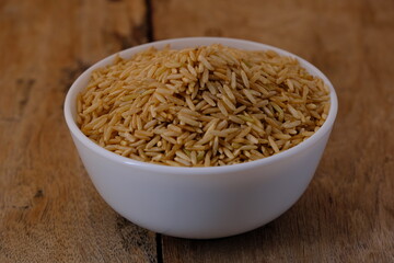 Raw brown rice in a bowl