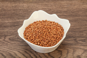 Raw buсkwheat cereal in the bowl