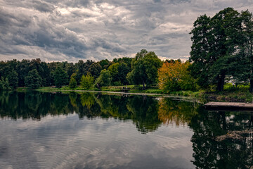 The Kuzminki Estate. Manor pond in the warm early autumn under a stormy sky. Autumn rural landscape. Moscow-September 2020