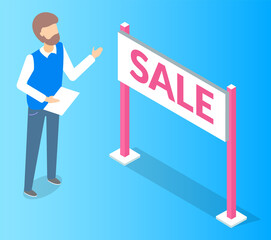 White sale sign with pink lettering and a man standing near. Promotional sale signal. Seasonal discounts at the supermarket. Male points to advertising sign on the desk with stand stands on supports