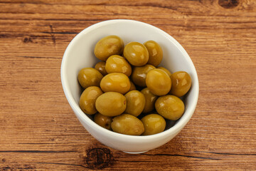 Green pickled olives in the bowl