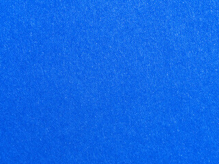 abstract blue texture background of paper fiber with more detail a high resolution and closeup of shining rough paper surface for wallpaper and graphic design