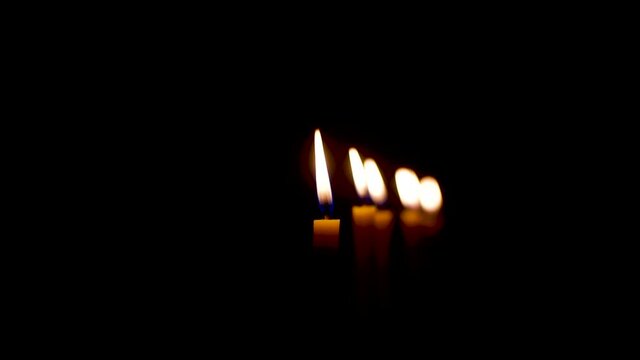The flame from the candle has a black background.