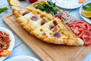 Turkish Sausage Pide or Sausage pizza / Sucuklu Pide