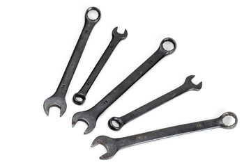 Spanner Set Isolated. dark coloured spanners on white background.