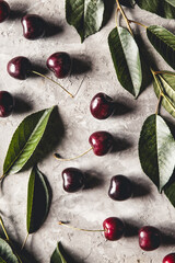 Sweet organic berries on a light concrete background. Top view with copy space.