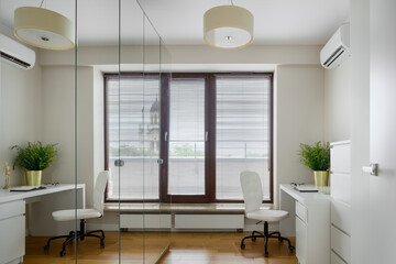 Home office with mirrored wardrobe