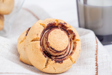 Champignon cookies on white cloth close
