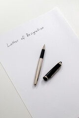 employee writing resignation letter on a blank paper