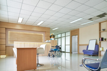 Empty lobby hospital counter and wheelchair for patient