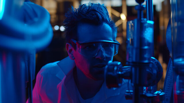 Close Up Of Crazy Chemist Making Experiment Using Large Equipment In Industrial Laboratory