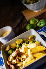 Gratinated Zurich ragout with Brussels sprouts, potatoes and Bearnaise sauce