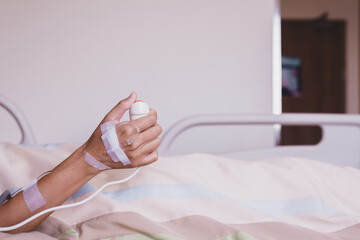 Patient woman using nurse call button for emergency belled at hospital