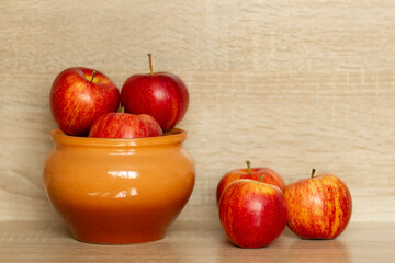 red fresh apples in a pot