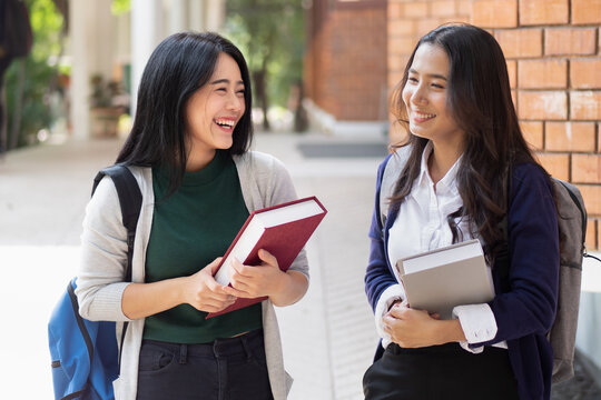 Happy Smiling Asian Woman College Student In University Campus With Her Classmate, Concept Of New Semester, Back To School, College Education Lifestyle