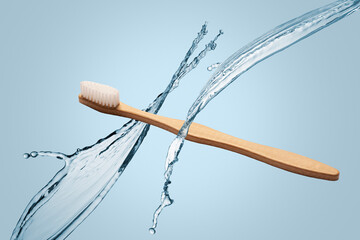 Single wooden natural bamboo toothbrush floating on a blue background with splashes of water in...