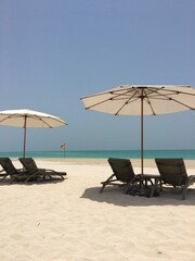 beach chairs and umbrella