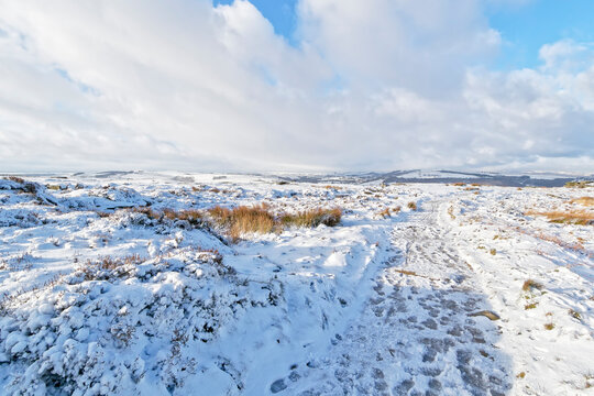 Snow clouds over white icy Derbyshire landscape