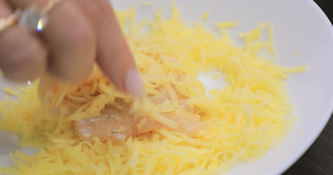 Chicken meat dipped in cheese for cooking and roasting
