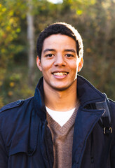 Portrait of a young man looking directly to the camera.