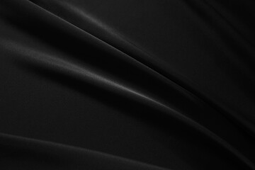 Black elegant background. Silk satin fabric with nice folds. Beautiful black background with wavy lines. Copy space.