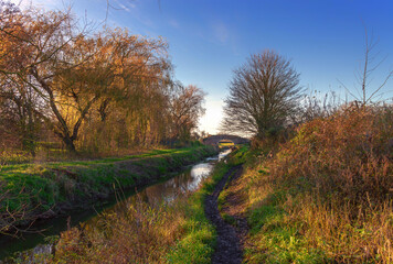 Rural scene with ancient bridge.