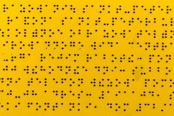 Sign with Braille. Caption for the blind