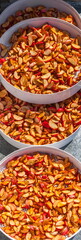 Dried cut apples in white round plastic trays for drying