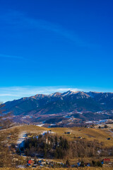 Beautiful mountain landscape in the Carpathian Mountains Romania at the transition from autumn to winter.