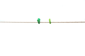 Colorful wooden clothespin hanging on rope. isolated on the white background.