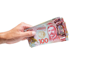 Obraz na płótnie Canvas New Zealand Dollars banknotes on white background.