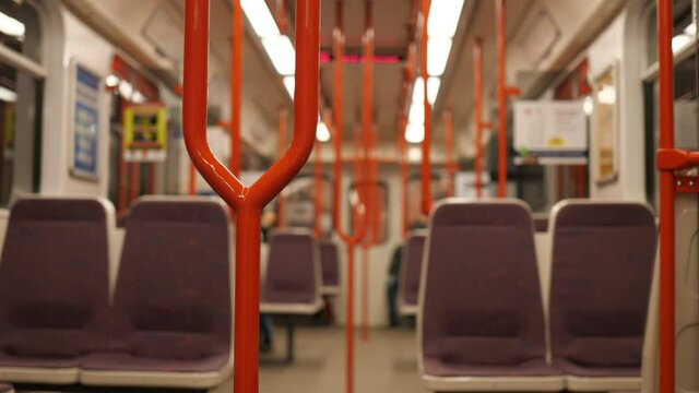 Empty Metro Train in Subway Public Transportation During Covid-19 Virus Pandemic and Lockdowns. Selective Focus, Slow Motion