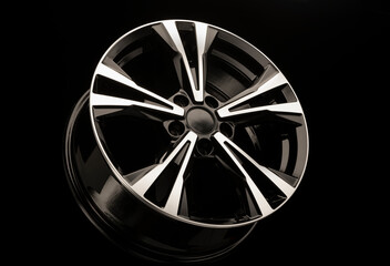 alloy wheels on a black background. New spare parts for the car or car tuning