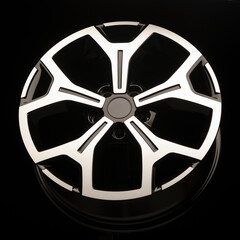 alloy wheels on a black background. New spare parts for the car or car tuning