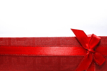 Red long box with red ribbons for jewerly or for any occasion isolated on a white background. Gift at the bottom with copy space