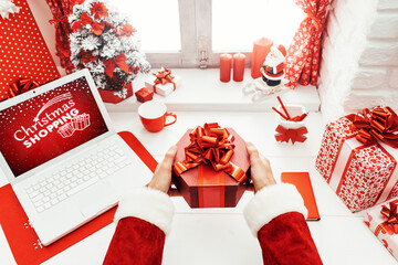 Santa holding a gift box