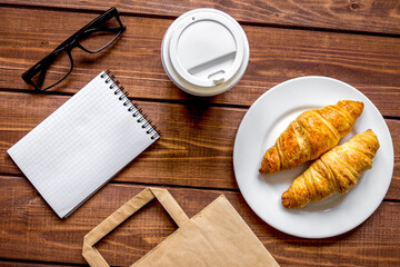 Business breakfast with coffee and croussant top view