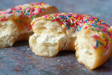  half eaten donuts on dark background 