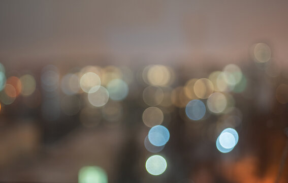 The evening lights of the city are in disfocus. The Blour effect