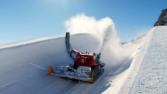 Ski resort is preparing a huge ski and snowboard halfpipe. Ski and snowboard half pipe in Tirol.