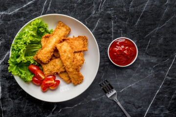 Breaded fried fish with vegetable